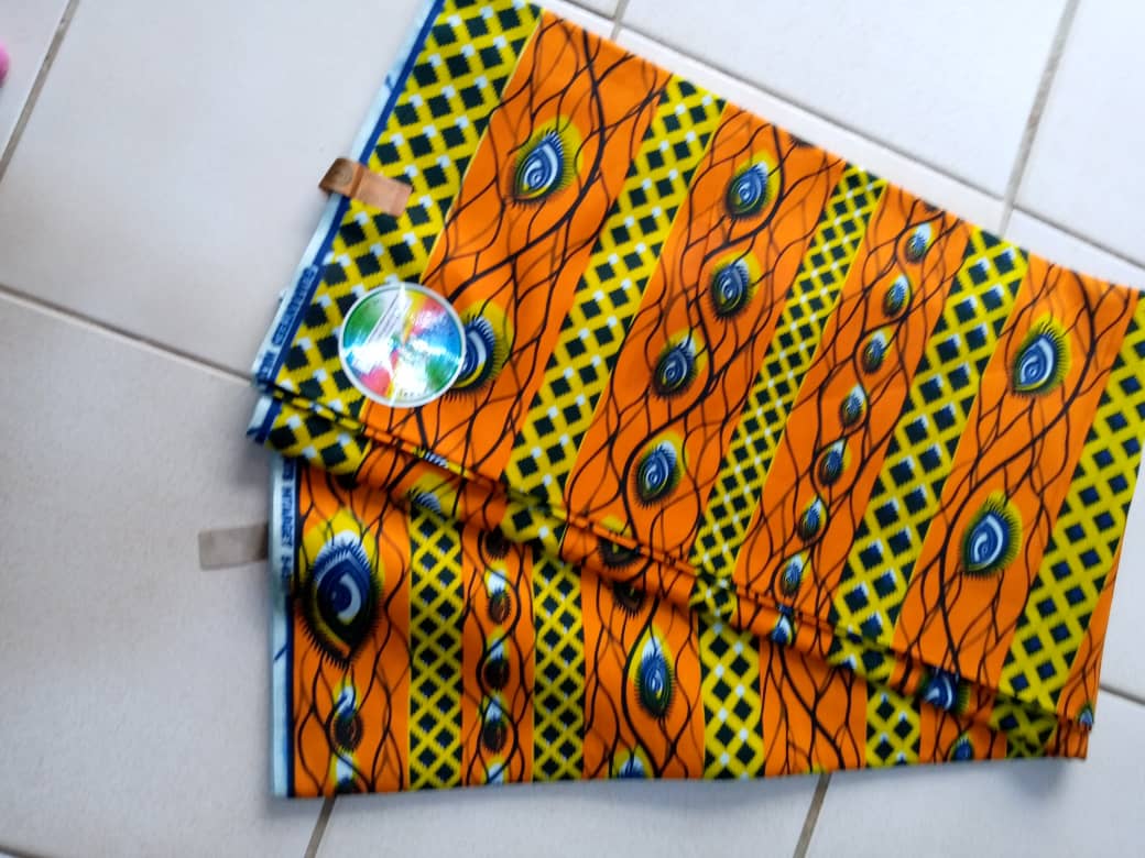 Pagne orangé et vert motif yeux